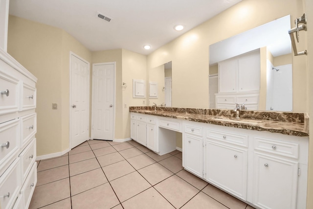 210 Squires Bnd, Stafford, TX 77477 - bathroom featuring double vanity, baseboards, tile patterned floors, and recessed lighting