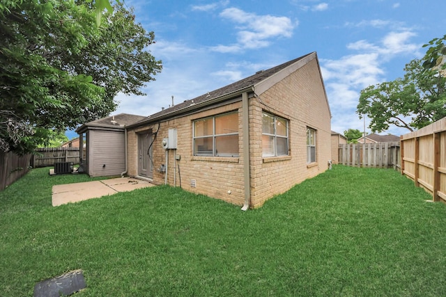 210 Squires Bnd, Stafford, TX 77477 - back of house with brick siding, cooling unit, and roof with shingles