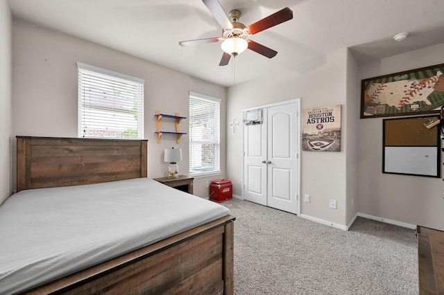 9175 White Tail Dr, Conroe, TX 77303 - bedroom with carpet flooring, baseboards, a closet, and ceiling fan