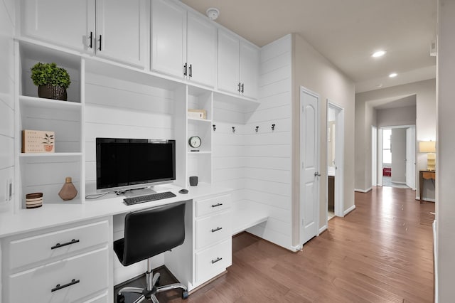 9175 White Tail Dr, Conroe, TX 77303 - home office with built in study area, light wood-style floors, recessed lighting, and baseboards