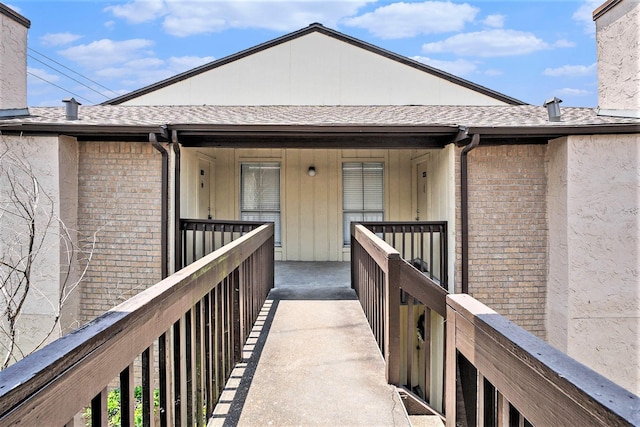1500 Bay Area Blvd Unit 424, Houston, TX 77058 - doorway to property with brick siding, roof with shingles, and covered porch