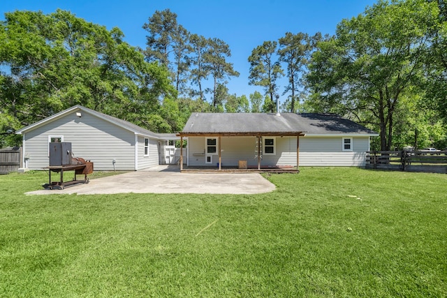 424 Hankamer Loop, Hankamer, TX 77560 - rear view of property with a patio
