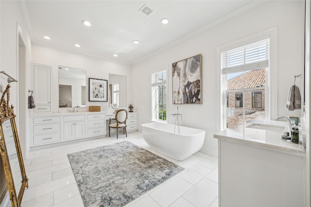 7506 Little Caprese Ln, Houston, TX 77055 - full bath featuring two vanities, a freestanding tub, crown molding, recessed lighting, and baseboards