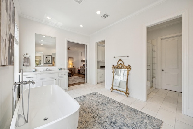 7506 Little Caprese Ln, Houston, TX 77055 - ensuite bathroom with a freestanding bath, crown molding, a stall shower, vanity, and tile patterned flooring