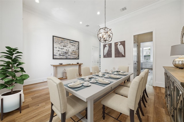 7506 Little Caprese Ln, Houston, TX 77055 - dining room with crown molding, a chandelier, recessed lighting, light wood-style floors, and baseboards