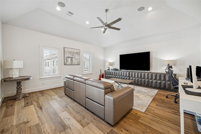 7506 Little Caprese Ln, Houston, TX 77055 - living area with vaulted ceiling, a ceiling fan, light wood-style floors, recessed lighting, and baseboards