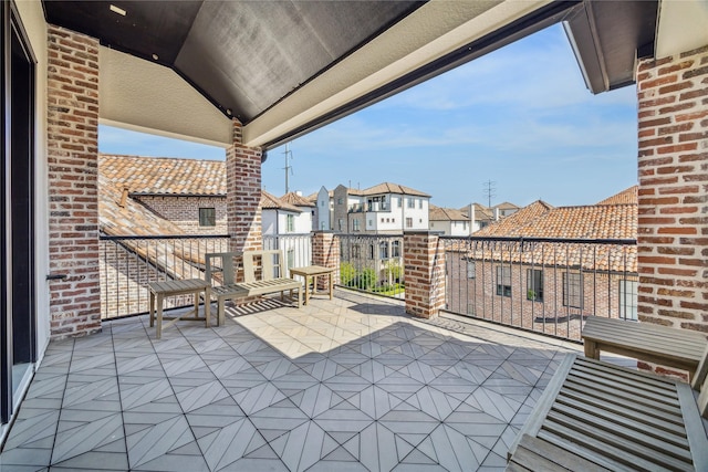 7506 Little Caprese Ln, Houston, TX 77055 - view of patio featuring a balcony and a residential view