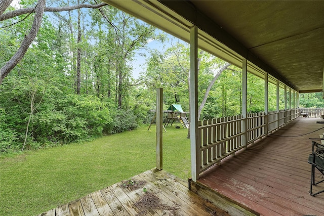 560 Donahoe Rd, Coldspring, TX 77331 - wooden terrace with a playground and a lawn