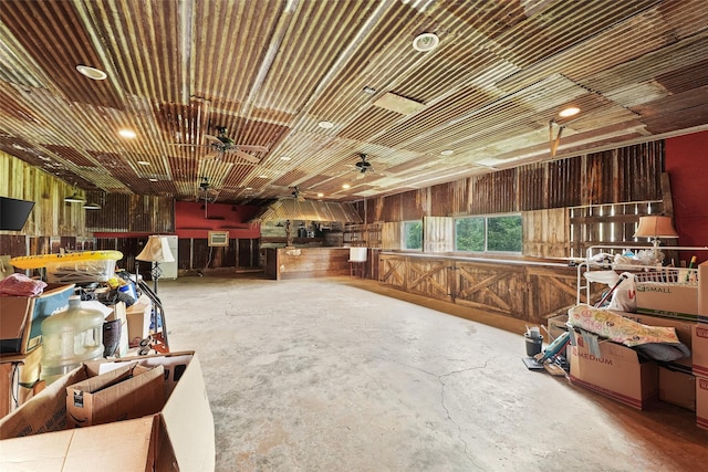 560 Donahoe Rd, Coldspring, TX 77331 - misc room with concrete floors, wooden walls, and a garage