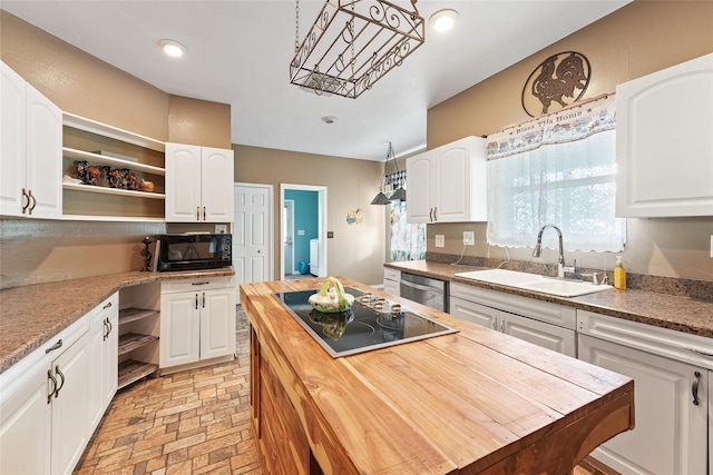 560 Donahoe Rd, Coldspring, TX 77331 - kitchen featuring a sink, black appliances, wood counters, open shelves, and white cabinetry