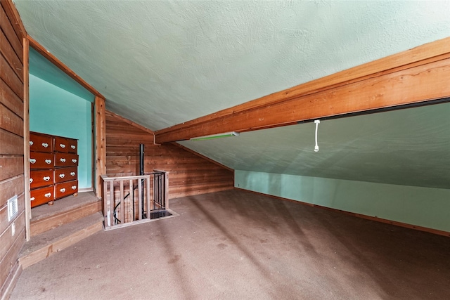 560 Donahoe Rd, Coldspring, TX 77331 - bonus room with wooden walls, lofted ceiling, and carpet