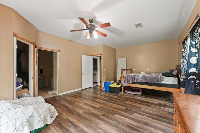 560 Donahoe Rd, Coldspring, TX 77331 - bedroom featuring wood finished floors, ceiling fan, baseboards, and ensuite bathroom