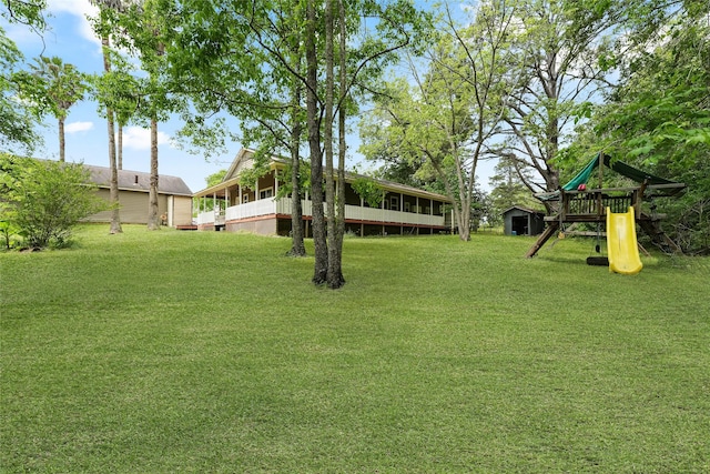 560 Donahoe Rd, Coldspring, TX 77331 - view of grassy yard featuring a playground
