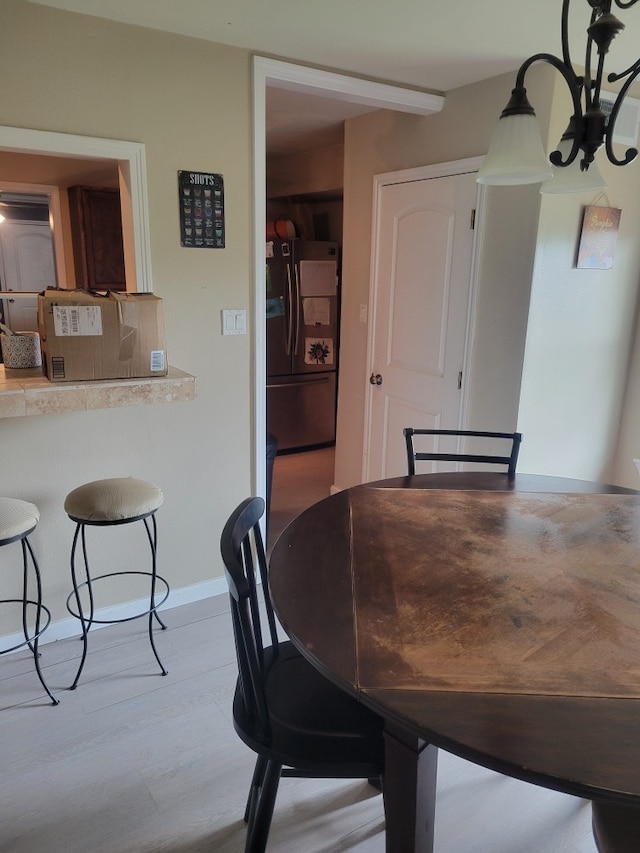 118 Whiting St, Galveston, TX 77550 - dining room with wood finished floors and a chandelier