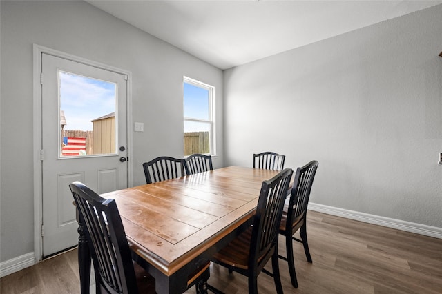 5527 Snapping Turtle Rd, Baytown, TX 77523 - dining space featuring baseboards and wood finished floors