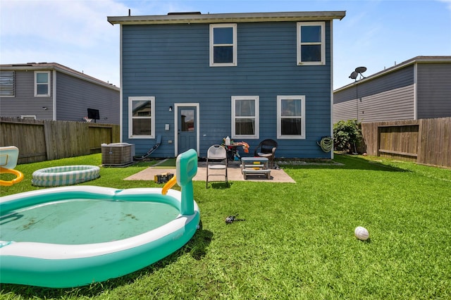 5527 Snapping Turtle Rd, Baytown, TX 77523 - back of house featuring a patio area and central AC unit