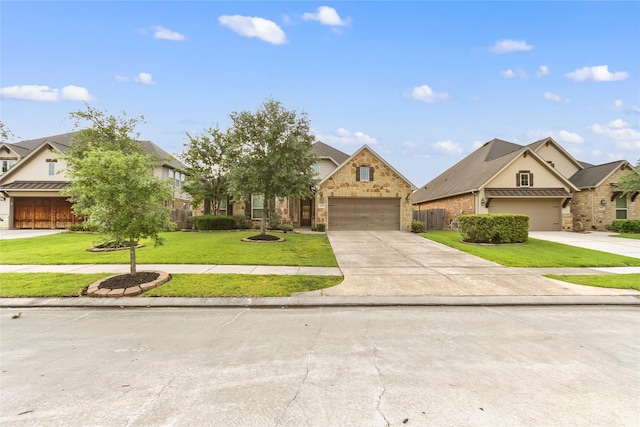 31428 Longwood Park Ln, Spring, TX 77386 - view of front of house featuring driveway, a front lawn, stone siding, and stucco siding