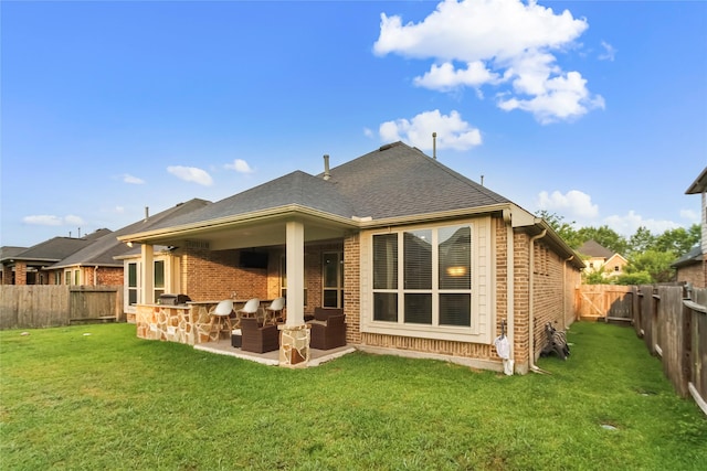 31428 Longwood Park Ln, Spring, TX 77386 - back of property featuring brick siding, roof with shingles, and a patio