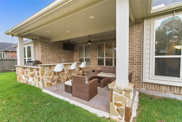 31428 Longwood Park Ln, Spring, TX 77386 - view of patio / terrace featuring exterior kitchen, a bar, a ceiling fan, and an outdoor living space