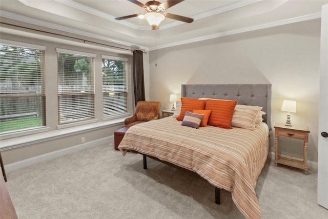 31428 Longwood Park Ln, Spring, TX 77386 - bedroom with a raised ceiling, light colored carpet, ornamental molding, baseboards, and a ceiling fan