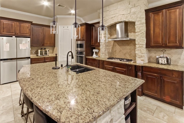 31428 Longwood Park Ln, Spring, TX 77386 - kitchen with appliances with stainless steel finishes, wall chimney range hood, a sink, light stone countertops, and a kitchen island with sink