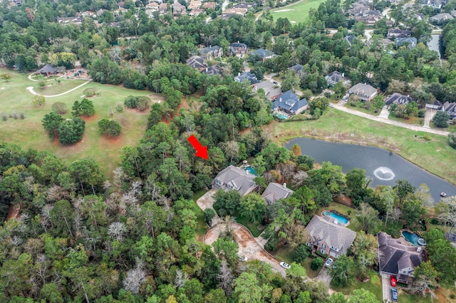 3 Forest Steppes Ct, The Woodlands, TX 77382 - aerial overview of property's location with a large body of water, nearby suburban area, and a golf club