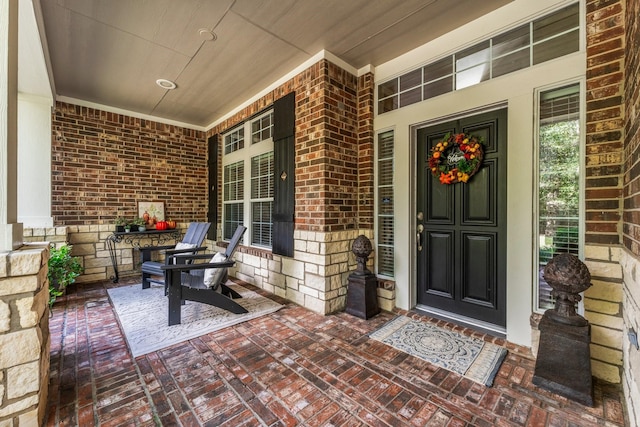 3 Forest Steppes Ct, The Woodlands, TX 77382 - view of exterior entry with a porch and brick siding
