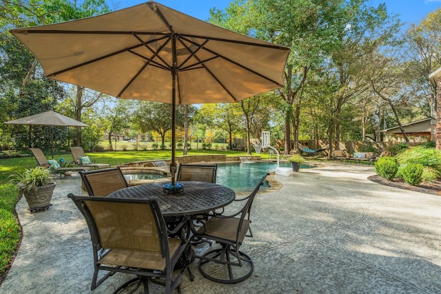 3 Forest Steppes Ct, The Woodlands, TX 77382 - view of patio / terrace with an outdoor pool and outdoor dining space