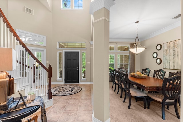 3 Forest Steppes Ct, The Woodlands, TX 77382 - entrance foyer featuring plenty of natural light, stairway, ornamental molding, decorative columns, and a high ceiling
