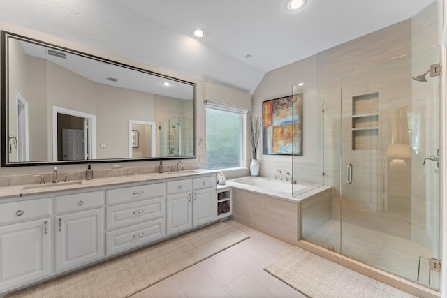 3 Forest Steppes Ct, The Woodlands, TX 77382 - bathroom with double vanity, a garden tub, a stall shower, lofted ceiling, and tile patterned flooring