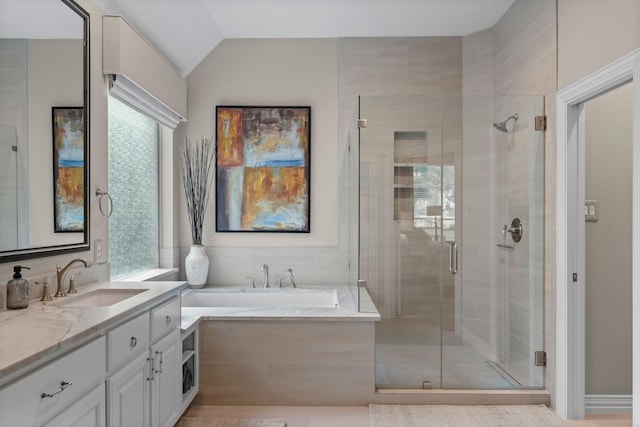 3 Forest Steppes Ct, The Woodlands, TX 77382 - bathroom featuring vanity, a garden tub, a shower stall, plenty of natural light, and lofted ceiling