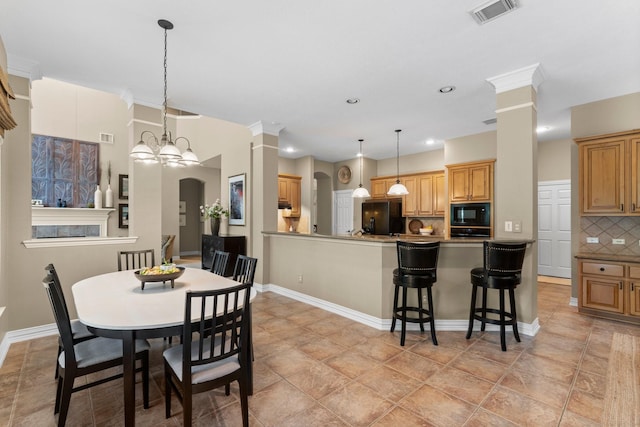 3 Forest Steppes Ct, The Woodlands, TX 77382 - dining area featuring decorative columns, recessed lighting, and baseboards