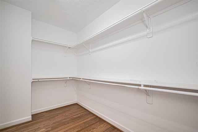 1108 W 22nd St, Houston, TX 77008 - walk in closet featuring wood finished floors