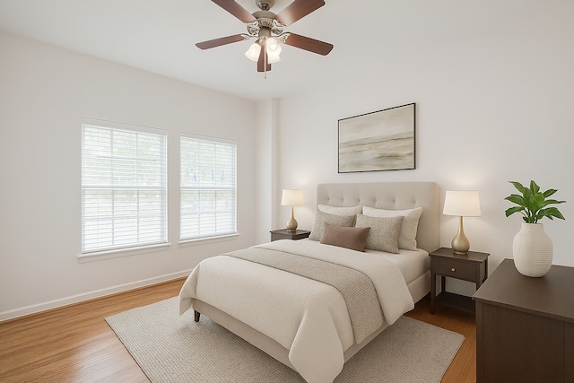 1108 W 22nd St, Houston, TX 77008 - bedroom featuring wood finished floors, multiple windows, baseboards, and ceiling fan