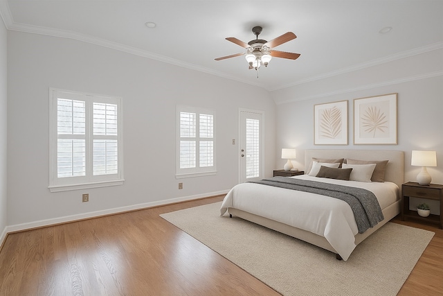 1108 W 22nd St, Houston, TX 77008 - bedroom with multiple windows, ornamental molding, wood finished floors, baseboards, and a ceiling fan
