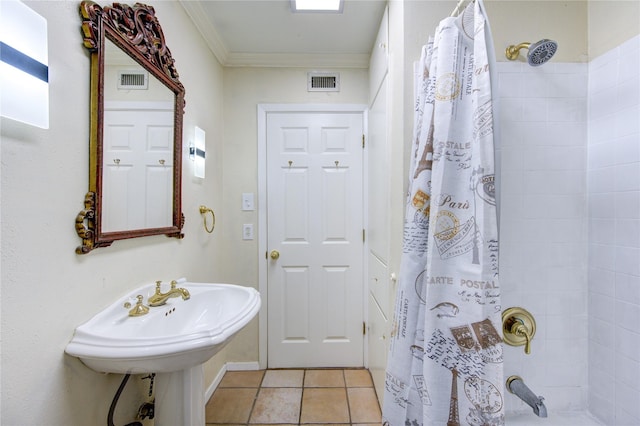 4040 San Felipe St Unit 203, Houston, TX 77027 - bathroom featuring crown molding, shower / bath combo with shower curtain, and tile patterned floors