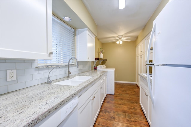 4040 San Felipe St Unit 203, Houston, TX 77027 - kitchen featuring white appliances, a sink, washing machine and clothes dryer, white cabinetry, and tasteful backsplash