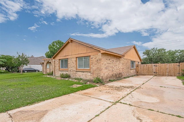 19531 Lazy Valley Dr, Katy, TX 77449 - view of property exterior with brick siding, a gate, and concrete driveway