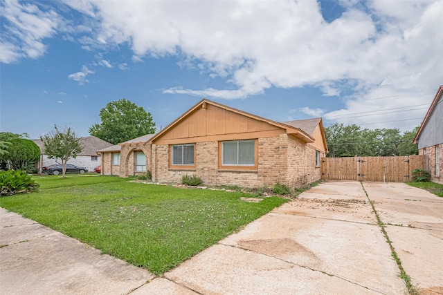 19531 Lazy Valley Dr, Katy, TX 77449 - ranch-style home with brick siding, a gate, and concrete driveway