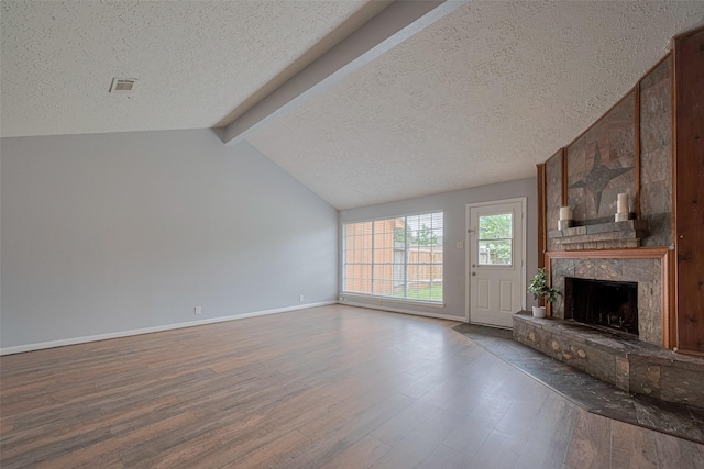 19531 Lazy Valley Dr, Katy, TX 77449 - unfurnished living room featuring a textured ceiling, a high end fireplace, wood finished floors, and baseboards