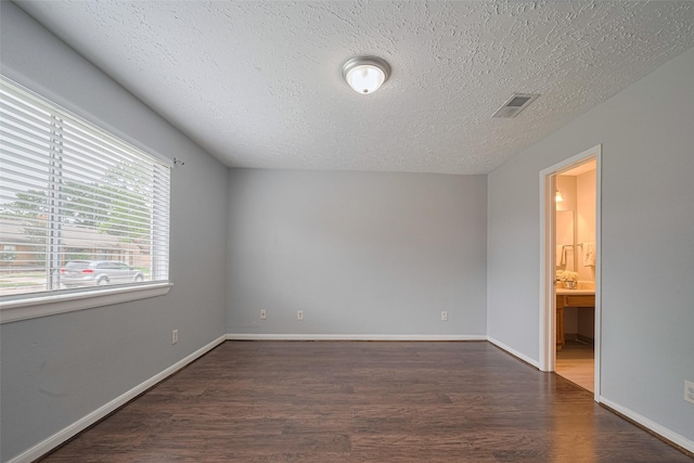 19531 Lazy Valley Dr, Katy, TX 77449 - unfurnished room with wood finished floors, a textured ceiling, and baseboards