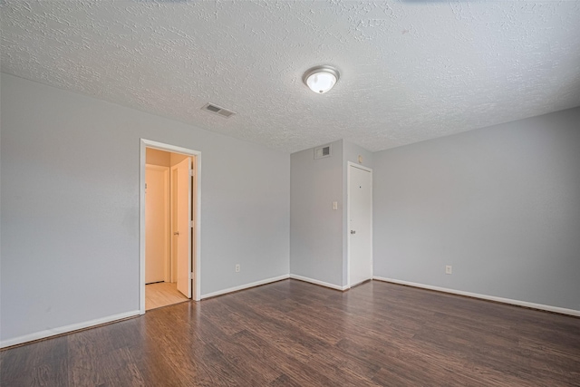 19531 Lazy Valley Dr, Katy, TX 77449 - empty room featuring wood finished floors, a textured ceiling, and baseboards
