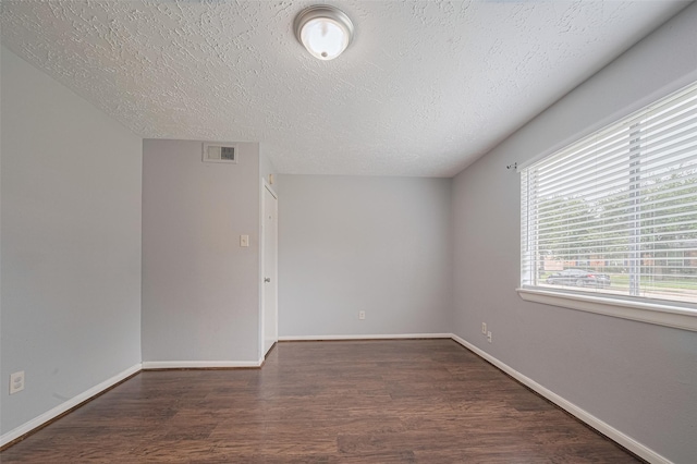 19531 Lazy Valley Dr, Katy, TX 77449 - spare room featuring wood finished floors, a textured ceiling, and baseboards