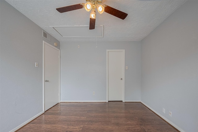 19531 Lazy Valley Dr, Katy, TX 77449 - empty room with a ceiling fan, a textured ceiling, wood finished floors, attic access, and baseboards