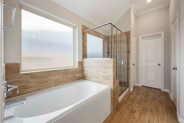 3677 Pinewood Bend Ln, Spring, TX 77386 - full bath with ornamental molding, a garden tub, a shower stall, and wood finished floors
