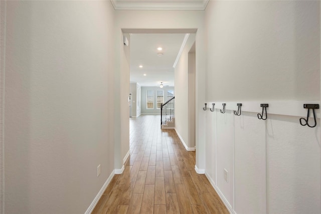 3677 Pinewood Bend Ln, Spring, TX 77386 - hallway with ornamental molding, light wood finished floors, baseboards, stairs, and recessed lighting