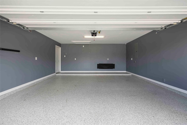3677 Pinewood Bend Ln, Spring, TX 77386 - garage featuring a garage door opener and baseboards