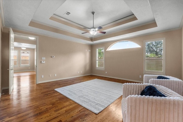 3707 Charleston St, Houston, TX 77021 - sitting room featuring a raised ceiling, ornamental molding, wood finished floors, and a ceiling fan