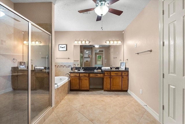 3707 Charleston St, Houston, TX 77021 - full bath with vanity, ceiling fan, a bath, a stall shower, and tile patterned flooring