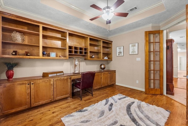 3707 Charleston St, Houston, TX 77021 - office area with built in study area, a raised ceiling, light wood finished floors, ceiling fan, and ornamental molding